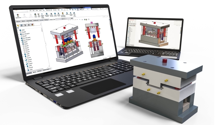 computer with blueprints of a device 