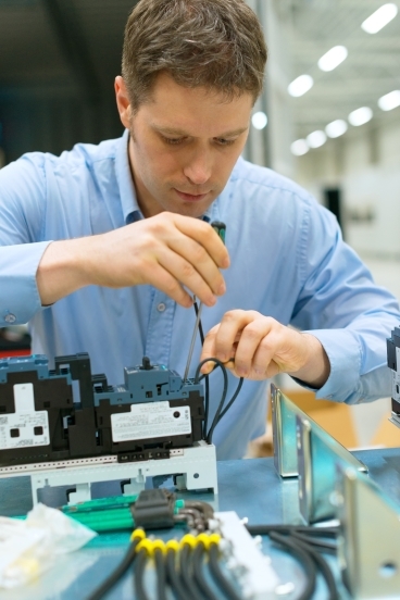 person working with wires