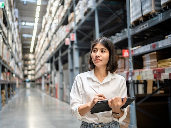 a woman taking inventory illustrating benefit of supplier consolidation