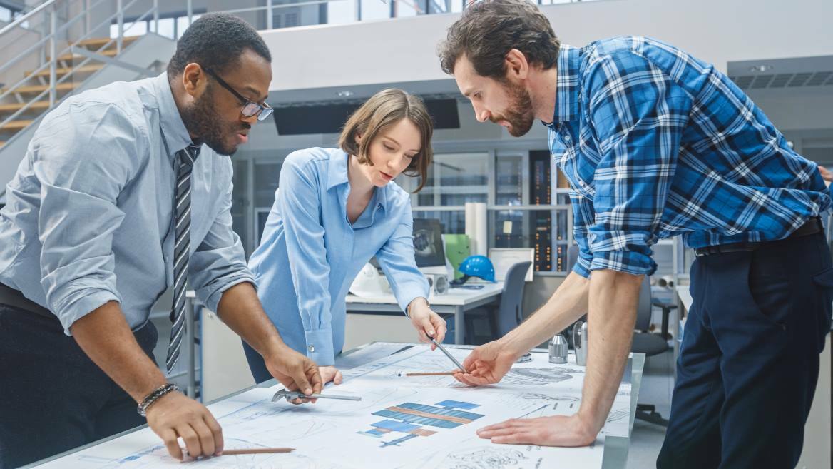 engineers collaborating during design stage to drive product innovation